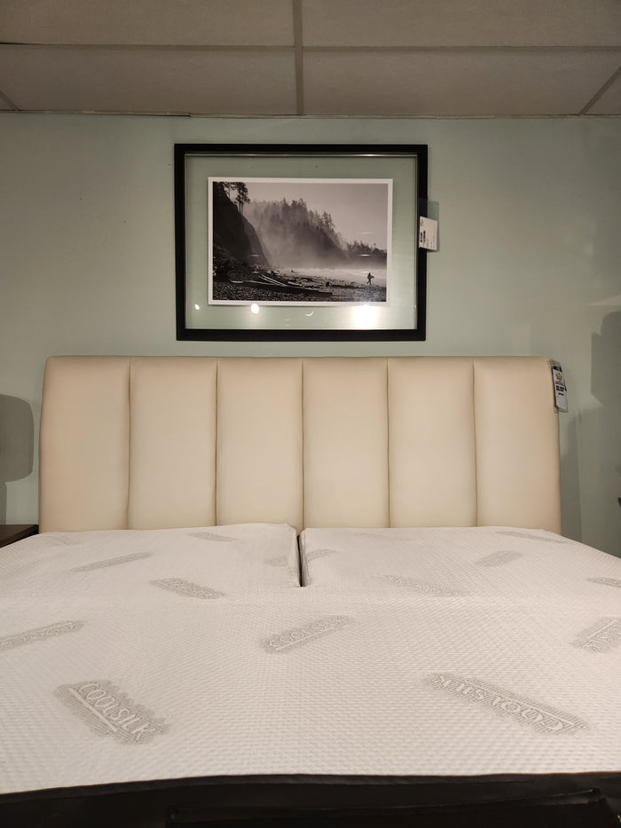 The Palliser 77140 Verttia King Upholstered Bed sits under a framed black-and-white landscape on a pale green wall.