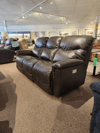 The 521 James Power Sofa by La-Z-Boy is displayed on carpet, accented by framed art in the showroom.