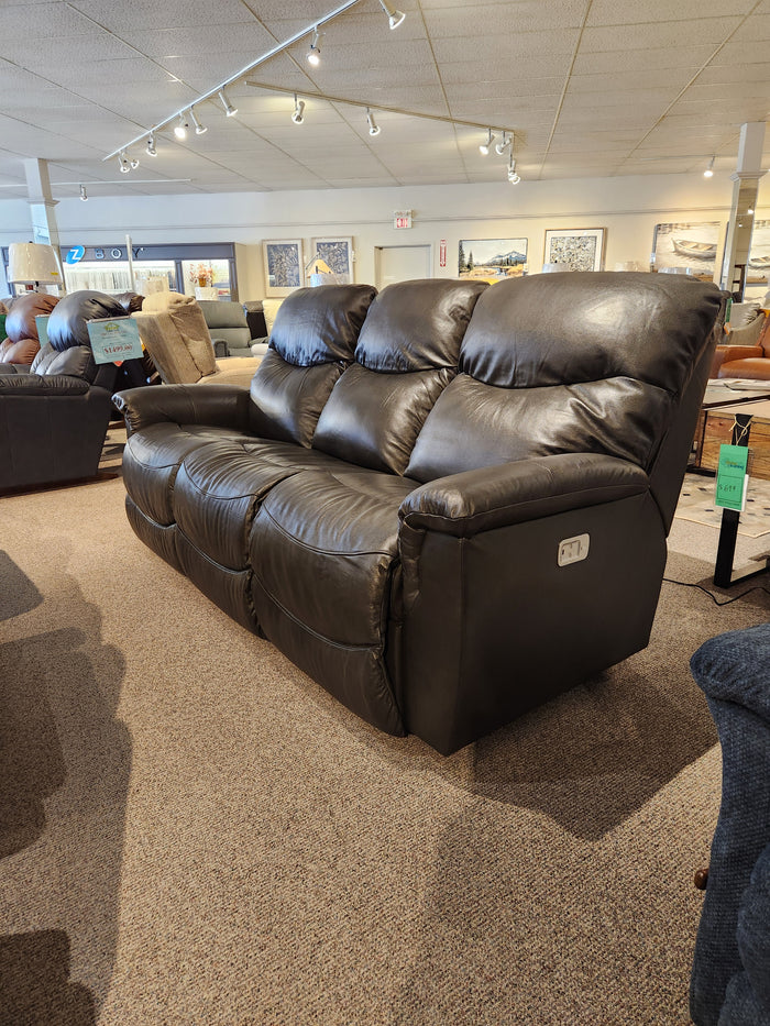 The 521 James Power Sofa by La-Z-Boy is displayed on carpet, accented by framed art in the showroom.