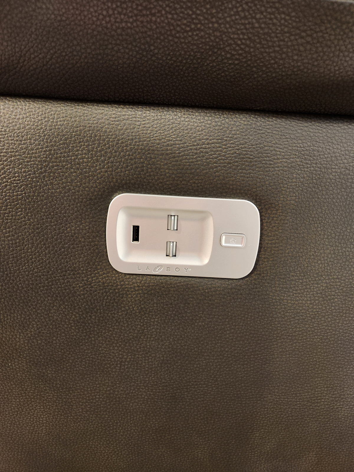Close-up of the La-Z-Boy 521 James Power Sofa panel with two USB ports and a button on brown textured upholstery.