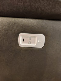 Close-up of the La-Z-Boy 521 James Power Sofa panel with two USB ports and a button on brown textured upholstery.