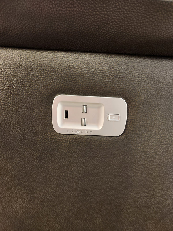 Close-up of the La-Z-Boy 521 James Power Sofa panel with two USB ports and a button on brown textured upholstery.