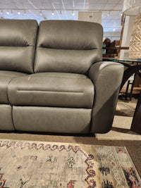 Leather Craft Texas Power Reclining Sofa in grey leather displayed on a patterned rug for enhanced comfort.