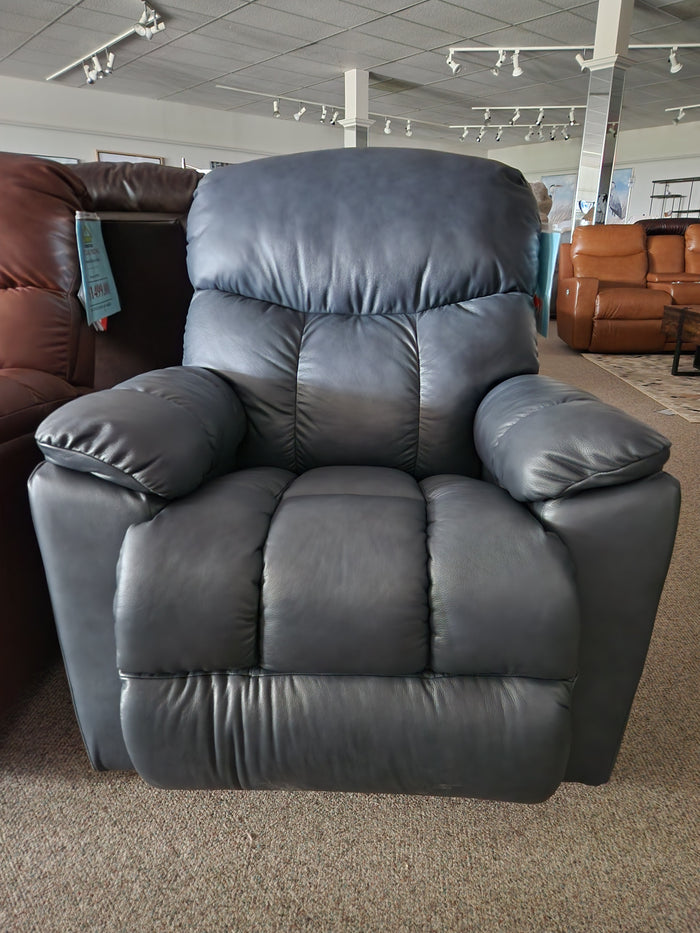 The La-Z-Boy 766 Morrison All Leather Rocker Recliner features padded arms and a tufted back, displayed in a showroom.