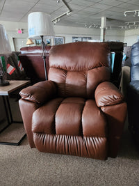 La-Z-Boy 766 Morrison All Leather Rocker Recliner in brown on display for comfort between lamps and other chairs.