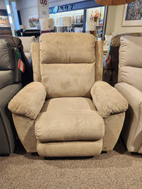 The La-z-boy 761 Joel Reclining Chair in beige with cushioned arms is shown among recliners in a showroom.