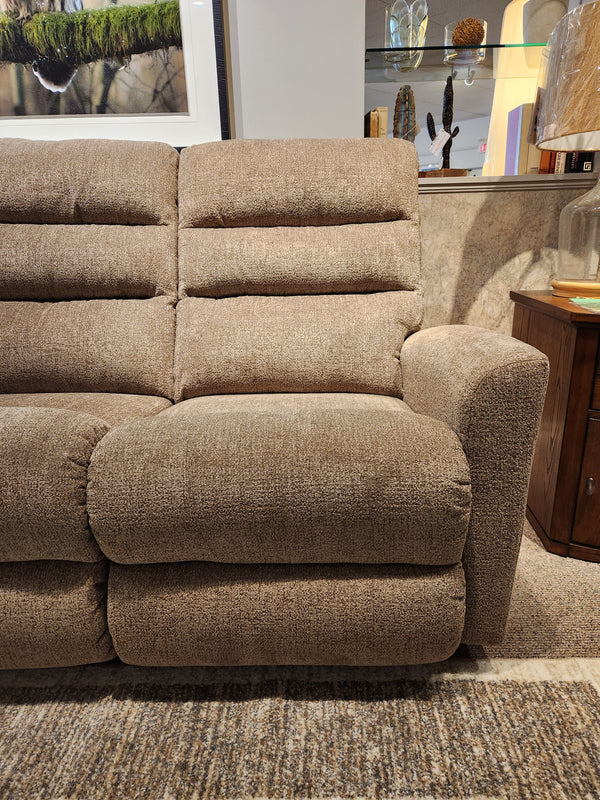 La-z-boy 786 Liam Power Reclining Sofa with adjustable legrests sits on a patterned rug by a wooden side table.