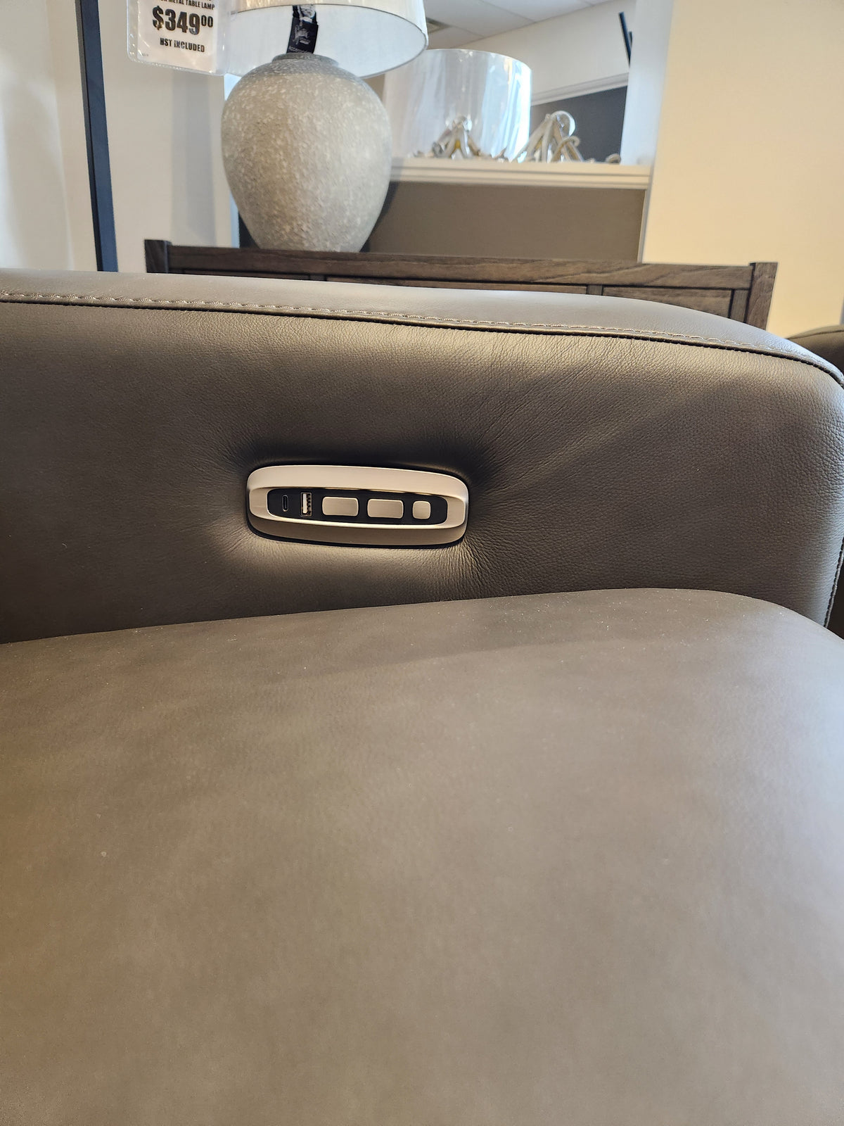 Close-up of La-z-boy 811 Acadia Power Reclining Sofa armrest with three buttons for customizable headrest support.
