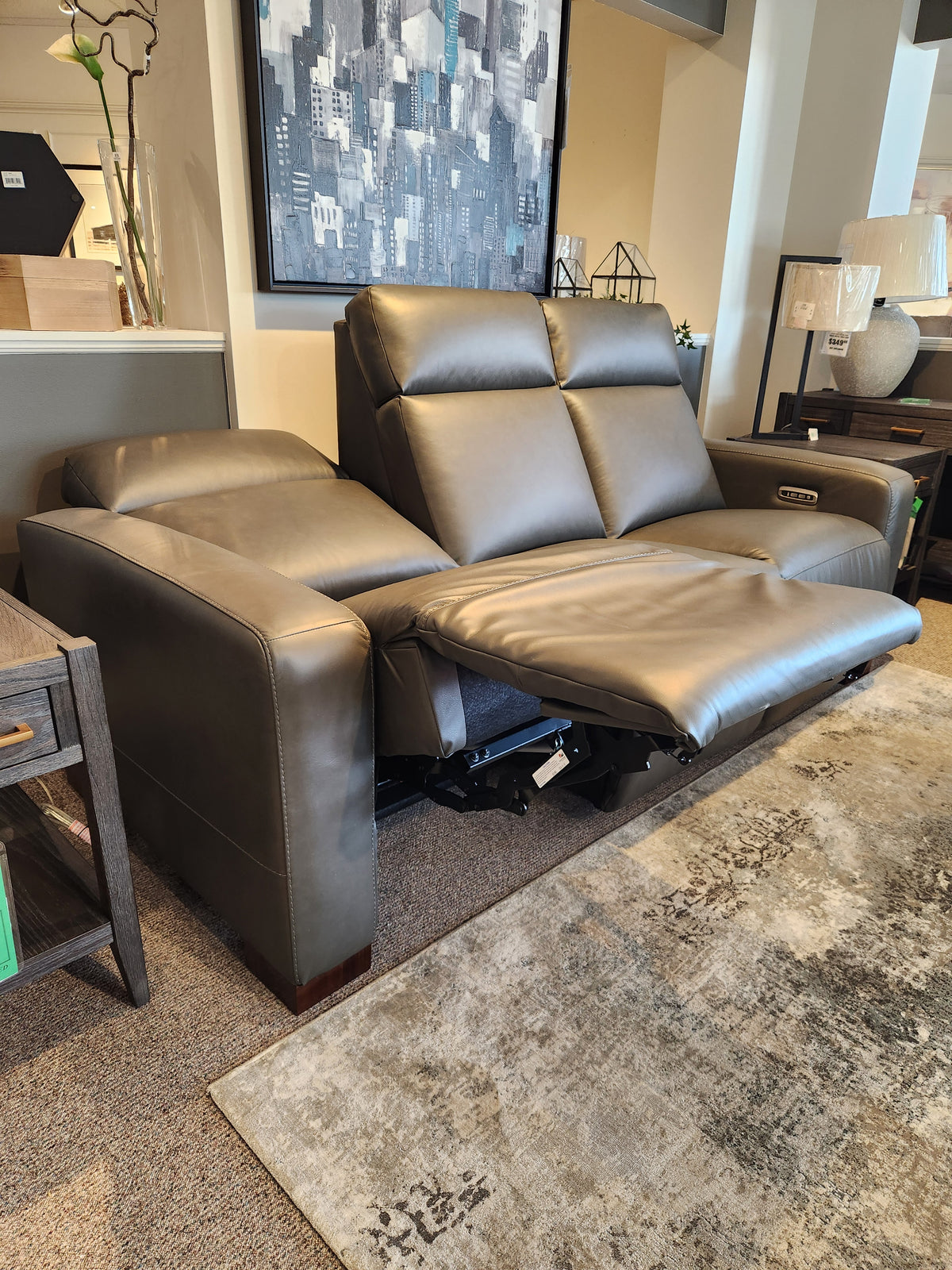 La-z-boy 811 Acadia power reclining sofa with headrest & zero grav, in gray leather, showcased in a modern showroom.