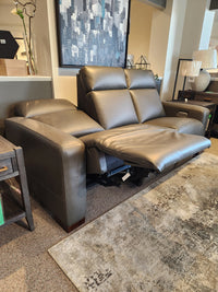 La-z-boy 811 Acadia power reclining sofa with headrest & zero grav, in gray leather, showcased in a modern showroom.