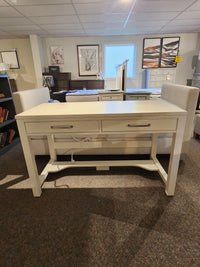 834 Laptop Desk by Ben & Erin Napier for Vaughan Bassett, North American hardwood with storage, shown in a stylish showroom.