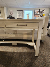 The 834 Laptop Desk by Ben & Erin Napier for Vaughan Bassett offers a drawer and is crafted from North American hardwood.