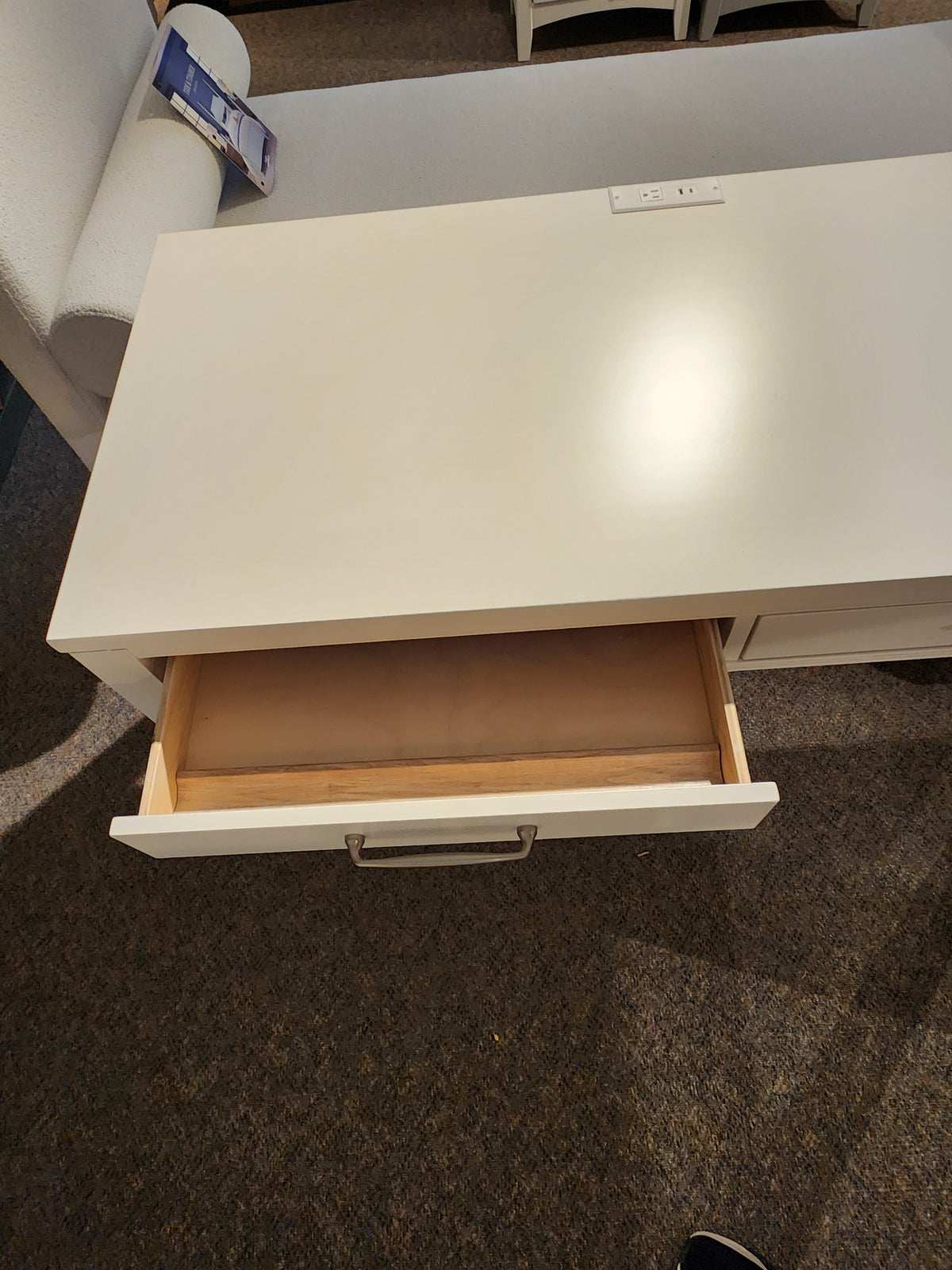The 834 Laptop Desk by Ben & Erin Napier for Vaughan Bassett offers storage and power outlets, crafted from North American hardwoods.