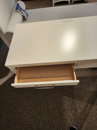 The 834 Laptop Desk by Ben & Erin Napier for Vaughan Bassett offers storage and power outlets, crafted from North American hardwoods.