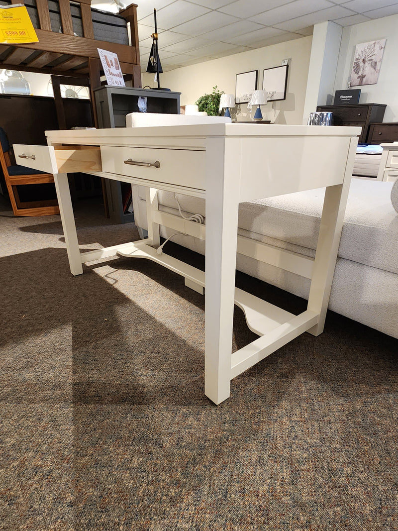 834 Laptop Desk by Ben & Erin Napier for Vaughan Bassett, white wood with storage, shown on brown carpet.