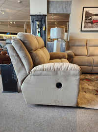 La-z-boy 761 Joel Reclining Loveseat in beige corduroy, with cushioned arm pads, shown among sofas and decor in showroom.