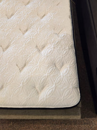 Close-up of the KingsDown Garland ET Plush Mattress featuring a textured, quilted cover for cool comfort.