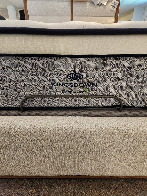 A close-up of the KingsDown Radiance 2 ET Firm Mattress showcases its pressure relief and stylish patterned side panel.