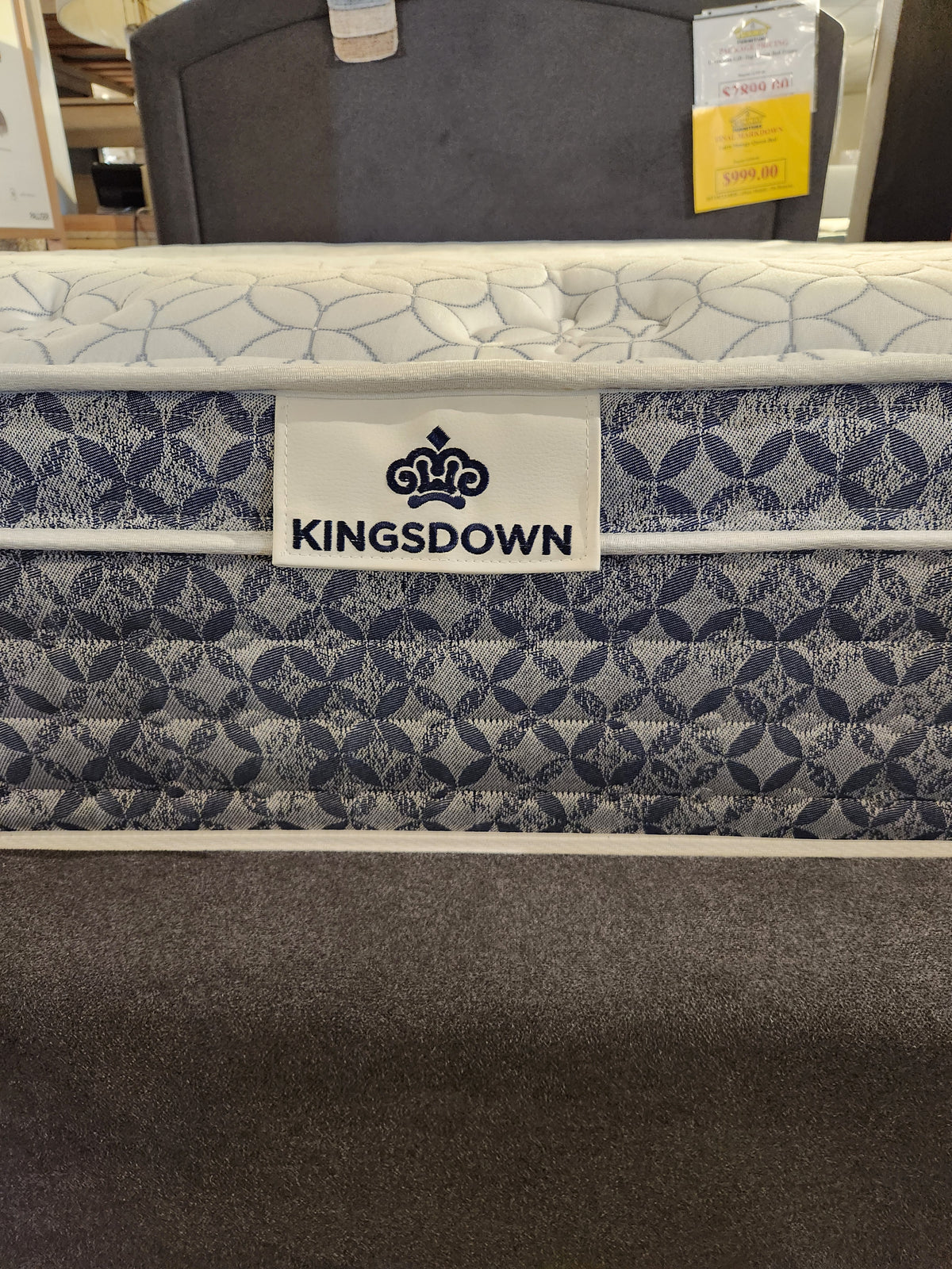 Close-up of KingsDown Paris 2 ET Plush Mattress with patterned fabric, plush comfort, and visible KingsDown label in store.