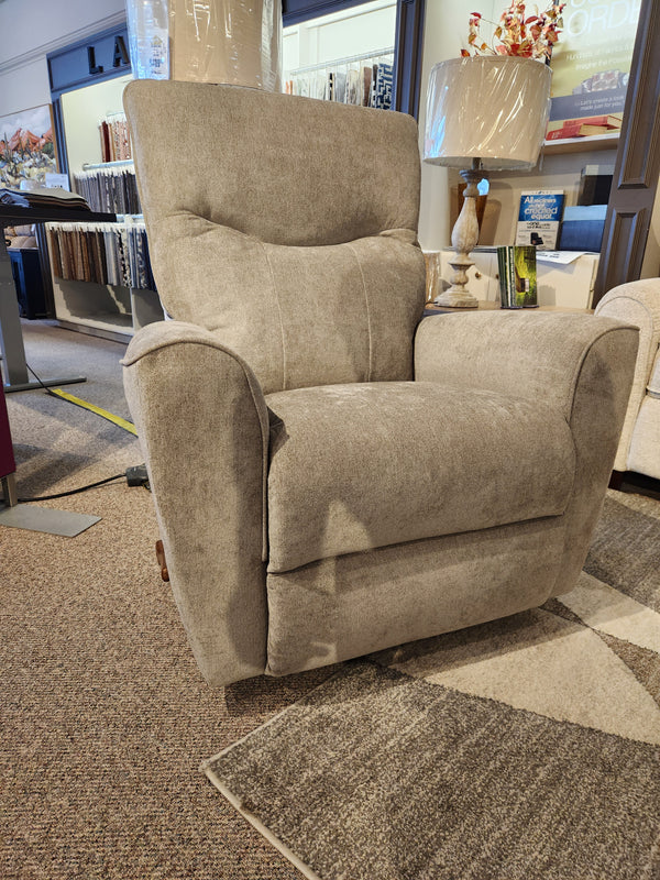 The La-Z-Boy 804 Belmont Rocker Recliner in light gray with lumbar support is shown on a carpeted showroom floor.