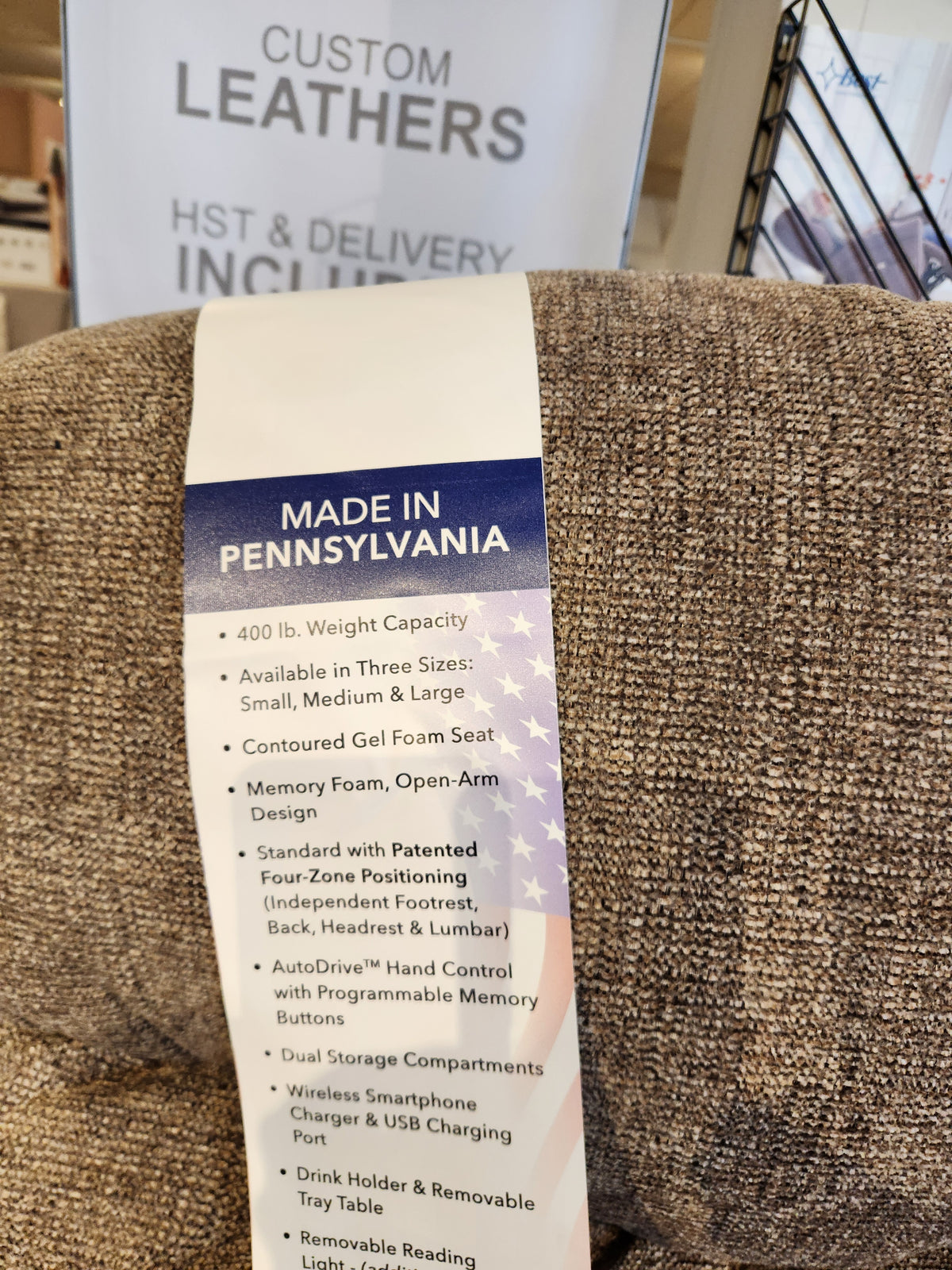 A tag on the Noah UC-566 Med Power Lift Chair by Golden lists features and says it’s made in Pennsylvania. Banner behind.