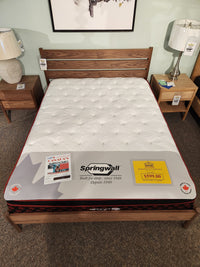 Springwall Canada Day Mattress by Springwall with Comfort Pockets HD foam on display—$599.00, promo signs on top.