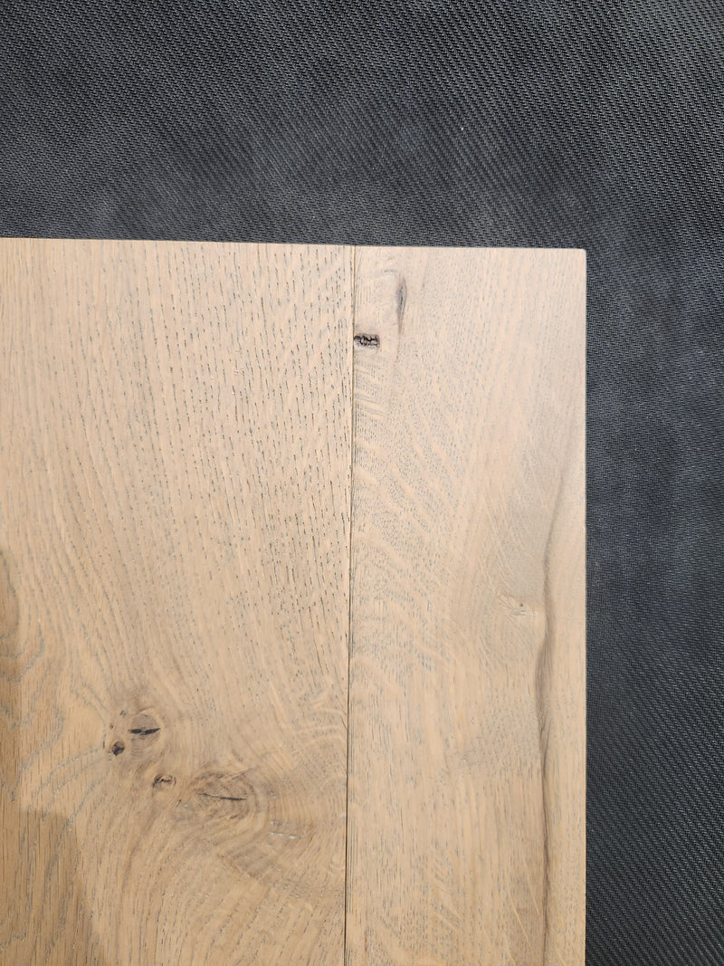 Two Montana Plank White Oak panels by Beckham Brothers sit side by side on a dark, textured surface.
