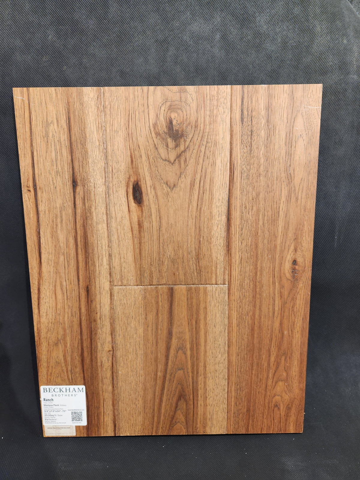 Rectangular Montana Plank White Oak sample by Beckham Brothers, natural grain on black, "Beckham" in lower left.