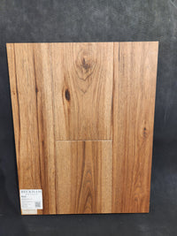 Rectangular Montana Plank White Oak sample by Beckham Brothers, natural grain on black, "Beckham" in lower left.