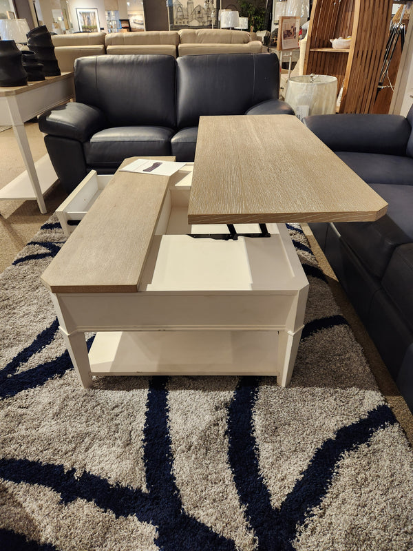 The Magnussen T6310-Echo Isles lift-top cocktail table sits open on a gray rug, showcasing transitional casual style.