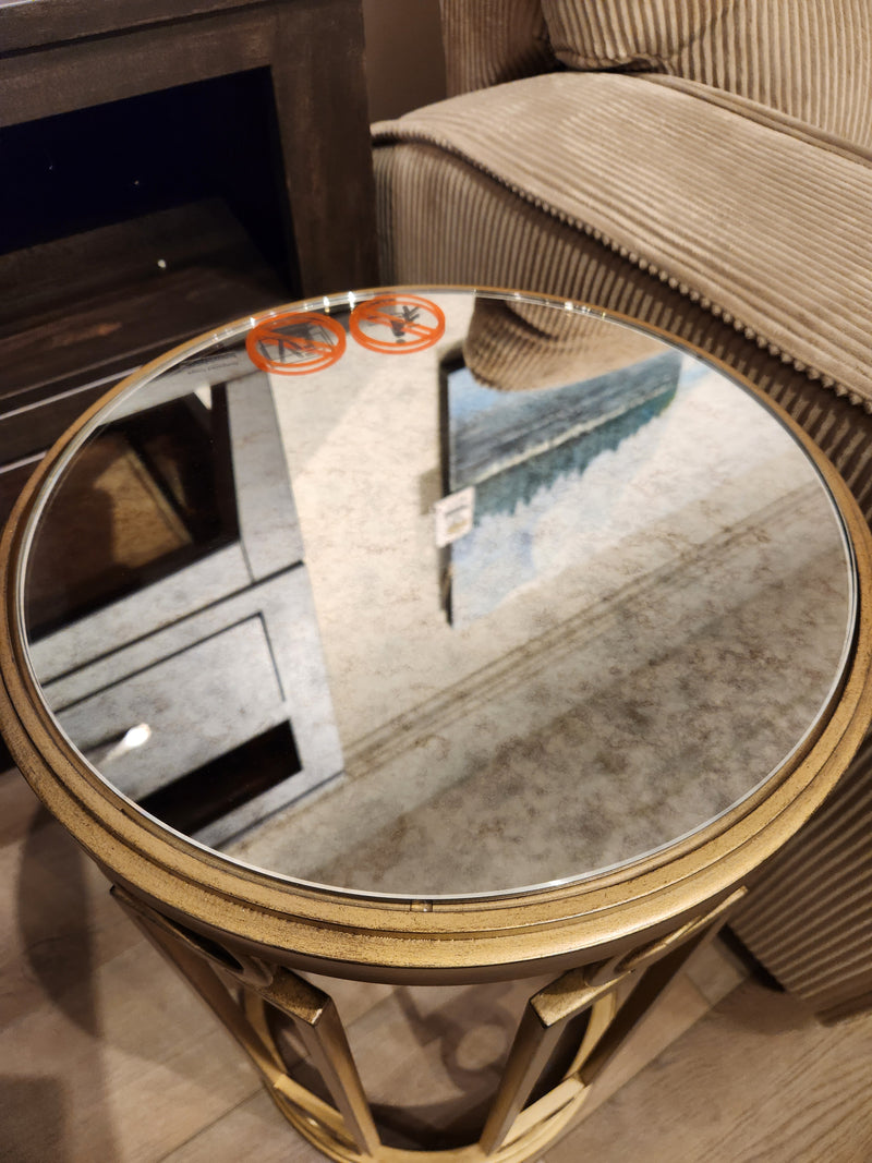 Magnussen T6300 Lorena round accent table, mirrored top, burnished brass finish; two no-touch stickers on surface.