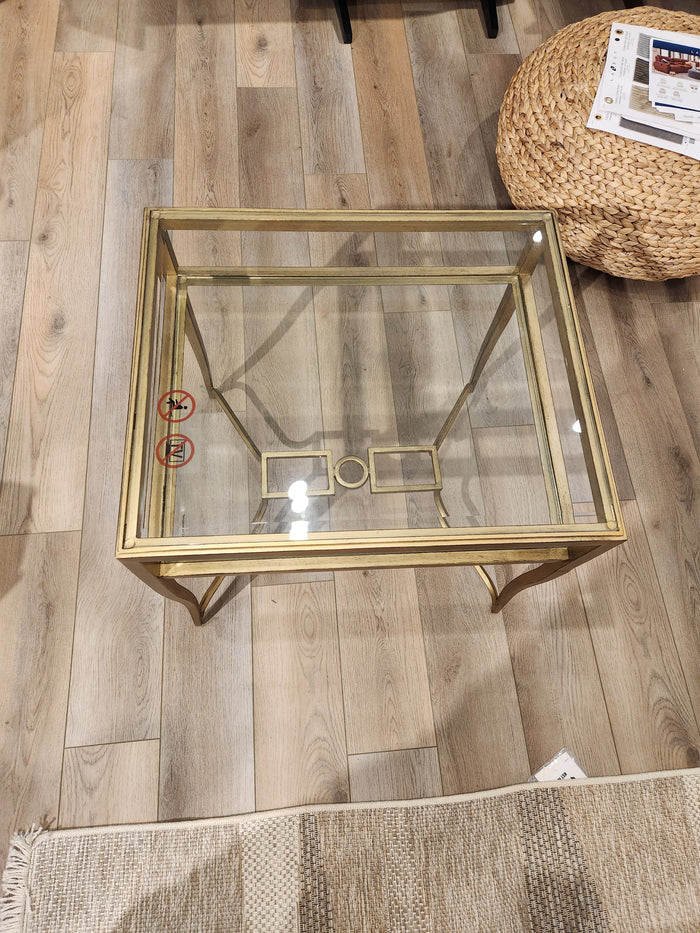 The Lorena End Table (T6300) by Magnussen features a square glass top and burnished brass, perfect for any inviting space.