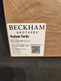 Label reads "Beckham Brothers New York Loft White Oak-Hardwood" with product specs on wood sample.