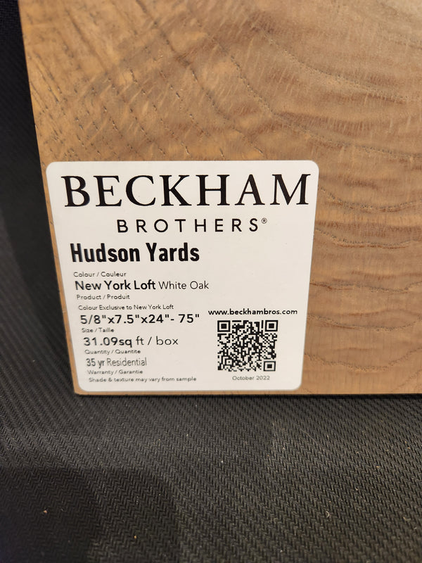 Label reads "Beckham Brothers New York Loft White Oak-Hardwood" with product specs on wood sample.