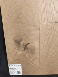 Close-up of Beckham Brothers New York Loft White Oak-Hardwood flooring, highlighting its rich grain and knots.