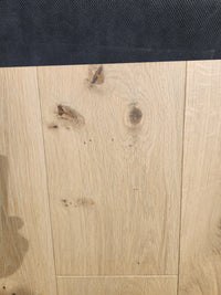 New York Loft White Oak-Hardwood by Beckham Brothers features light wood with knots and a dark textured border on top.