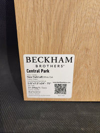 A sample of Beckham Brothers New York Loft White Oak-Hardwood flooring with labeled product details.