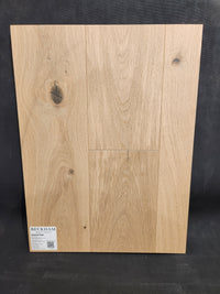 Sample board of New York Loft White Oak-Hardwood by Beckham Brothers, showing natural wood knots and plank texture.
