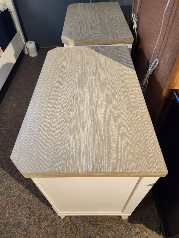 Two Magnussen Echo Isles Night Stands in quartered oak bring casual style to any carpeted bedroom.