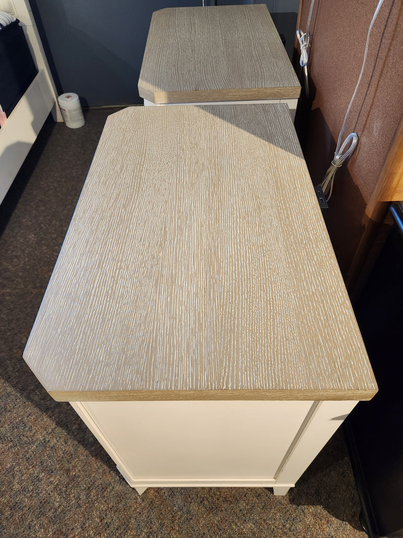 Two Magnussen Echo Isles Night Stands in quartered oak bring casual style to any carpeted bedroom.