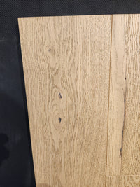 Beckham Brothers Heritage Plank White Oak: light-colored panels with visible grain and knots, shown on a dark background.