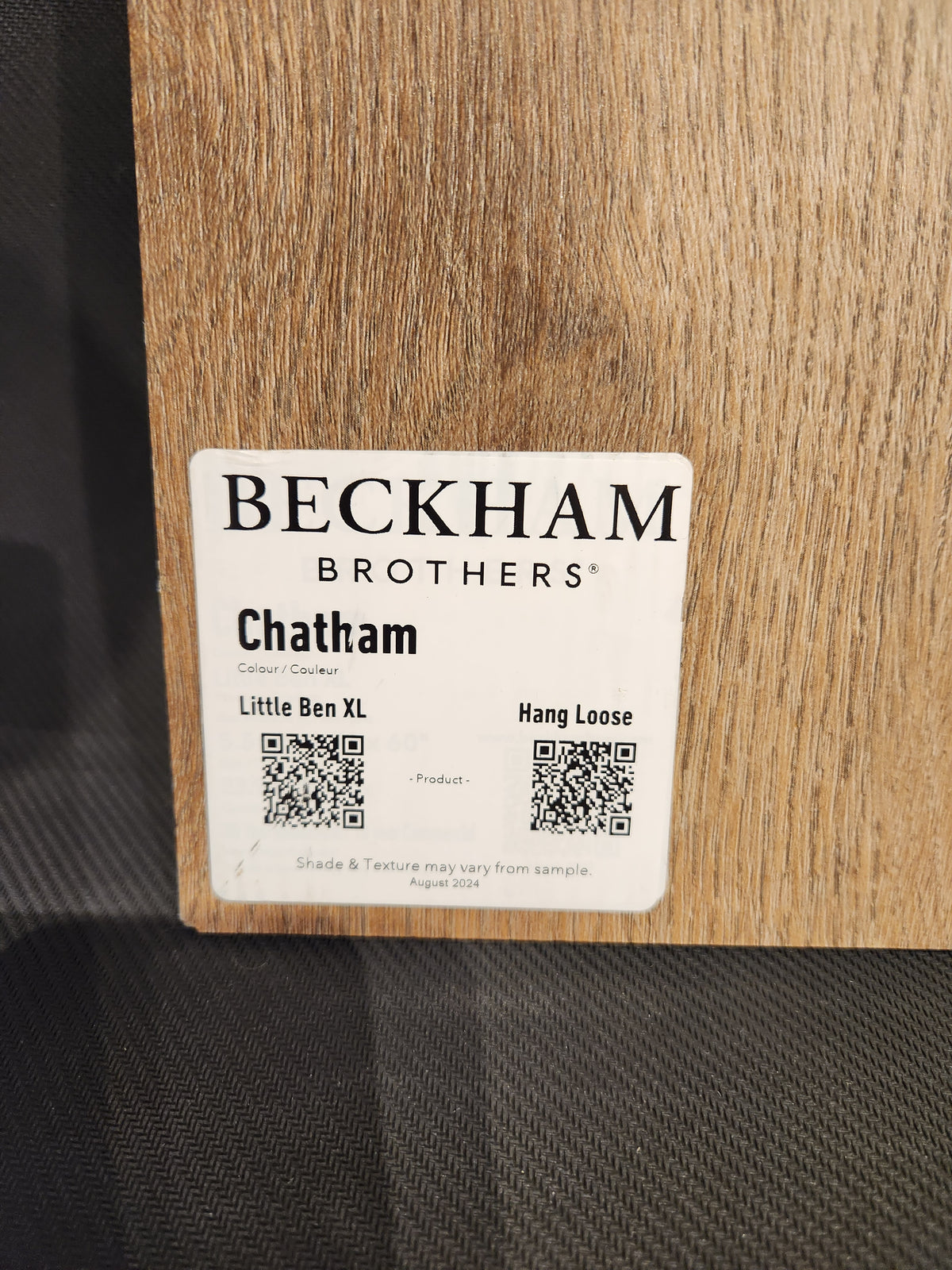 A sample of Beckham Brothers Hang Loose Luxury Vinyl (Glue-Down Plank) on a textured surface.