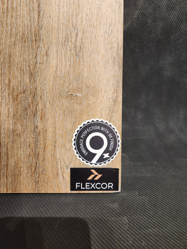 A wood-textured Little Ben XL Luxury Vinyl (Click Plank) by Beckham Brothers features 9X Coating and FLEXCOR flooring.