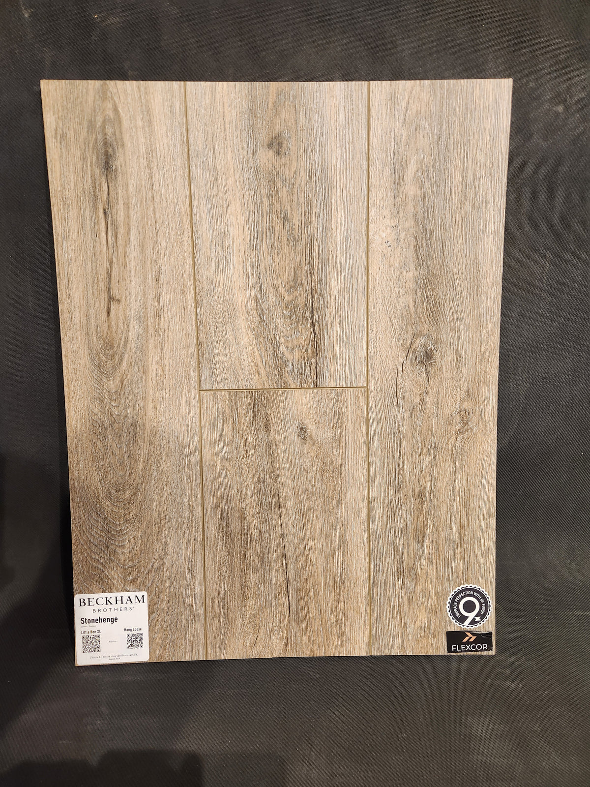 Wood-look Hang Loose Luxury Vinyl (Glue-Down Plank) by Beckham Brothers, sample shown on a black background.