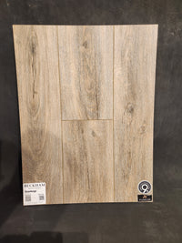 Wood-look Hang Loose Luxury Vinyl (Glue-Down Plank) by Beckham Brothers, sample shown on a black background.