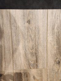 Little Ben XL Luxury Vinyl (Click Plank) by Beckham Brothers in light brown with grain, shown in natural lighting.