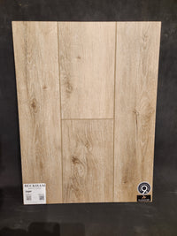 Sample board of Hang Loose Luxury Vinyl Glue-Down Plank by Beckham Brothers on a black background.