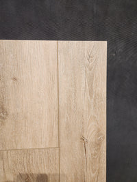 Hang Loose Luxury Vinyl (Glue-Down Plank) by Beckham Brothers is shown on a dark textured background.