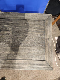 The Gramercy 2 Door Accent Cabinet by Jofran features a wire-brushed wood top with visible grain and partial shadow.