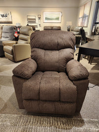 The La-z-boy 766 Morrison Power XR Recliner is showcased in a showroom with other chairs in the background.